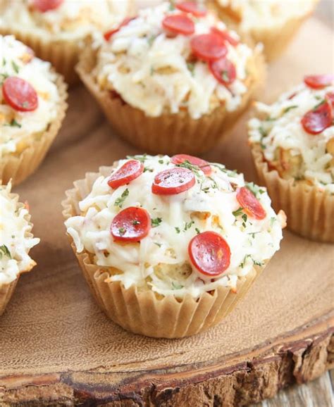 Pizza cupcake - Instructions. Spray 2 muffin tins with non stick spray. Preheat your oven to package directions. Roll out the pizza dough on a flat surface, then spread the sauce over the dough, leaving a 1-inch space along one long edge of the dough. Add your cheese and toppings. 